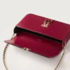 Bolso de cadena mini, Double C de Cartier – Piel de becerro rojo cereza, acabado en oro y esmalte rojo cereza – Cartier