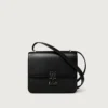 Bolso de hombro, Mini, Double C de Cartier – Piel de becerro negra, acabado en oro y esmalte negro – Cartier