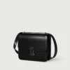 Bolso de hombro, Mini, Double C de Cartier – Piel de becerro negra, acabado en oro y esmalte negro – Cartier