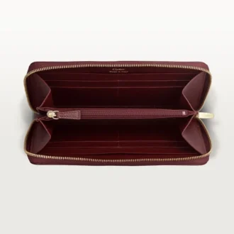 Cartera internacional con cremallera, Must De Cartier – Piel de becerro burdeos, acabado dorado – Cartier