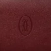 Cartera internacional con fuelles, Must de Cartier – Piel de becerro burdeos, acabado dorado – Cartier