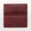 Cartera internacional con fuelles, Must de Cartier – Piel de becerro negra, acabado en acero inoxidable – Cartier