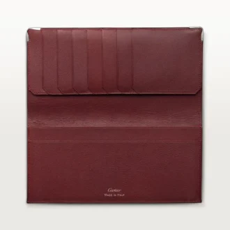 Cartera internacional con fuelles, Must de Cartier – Piel de becerro negra, acabado en acero inoxidable – Cartier