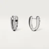 Pendientes pequeños de aro Panthere Diamond, oro blanco | Cartier EE. UU.